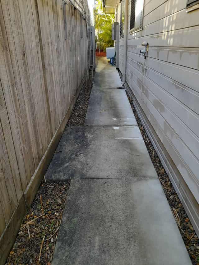The same home before the wash, with visible mould and grime